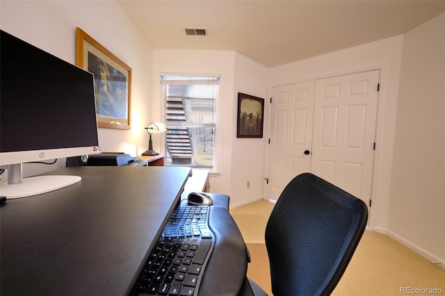 office space with light colored carpet, mail area, visible vents, and baseboards