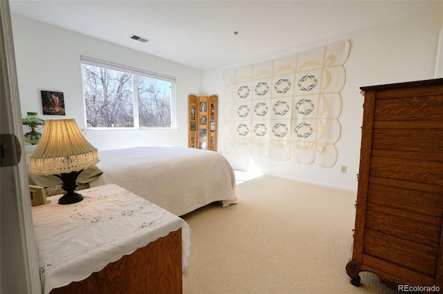 bedroom featuring carpet floors and visible vents