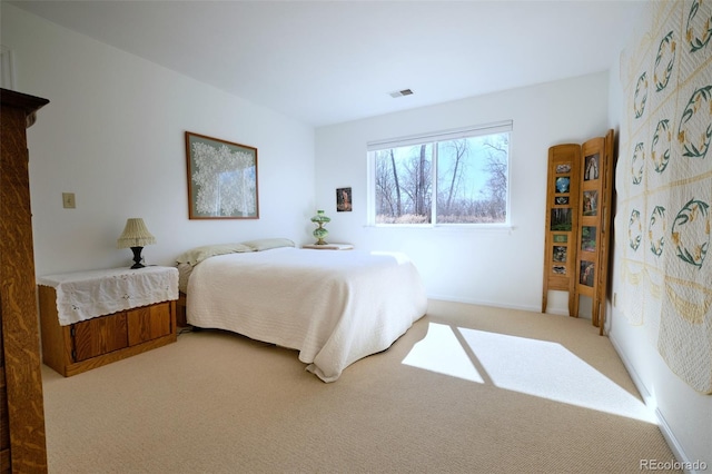 bedroom with visible vents and carpet flooring