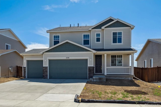 craftsman-style home with a porch, fence, a garage, and driveway