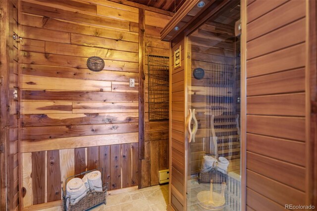 view of sauna featuring stone finish floor