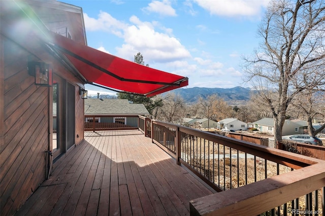 deck featuring a residential view and a mountain view