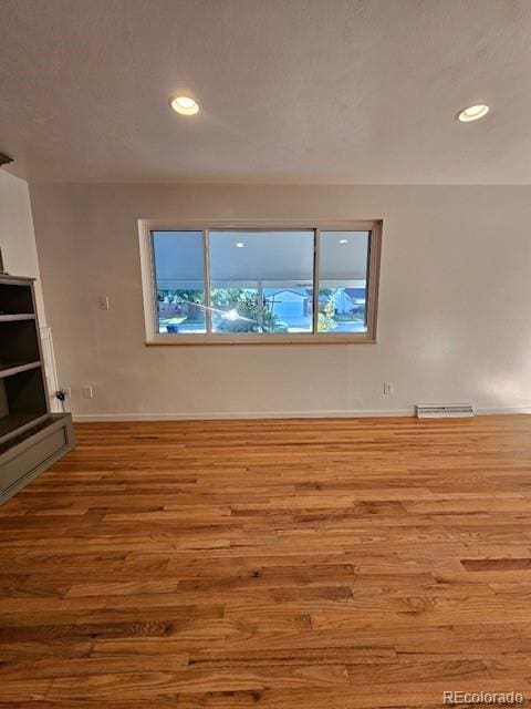 spare room featuring light wood-type flooring