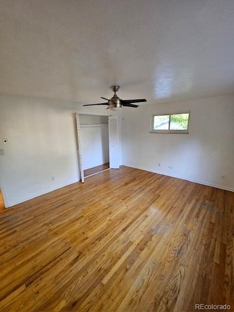 unfurnished room featuring light wood-type flooring and ceiling fan