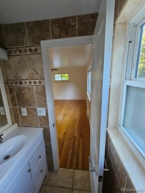 bathroom featuring vanity and hardwood / wood-style flooring