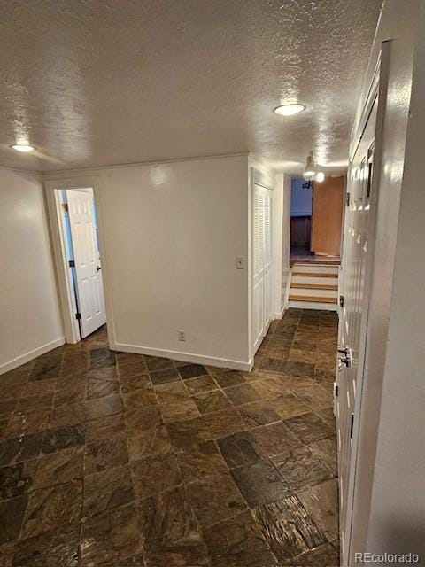 interior space with a textured ceiling