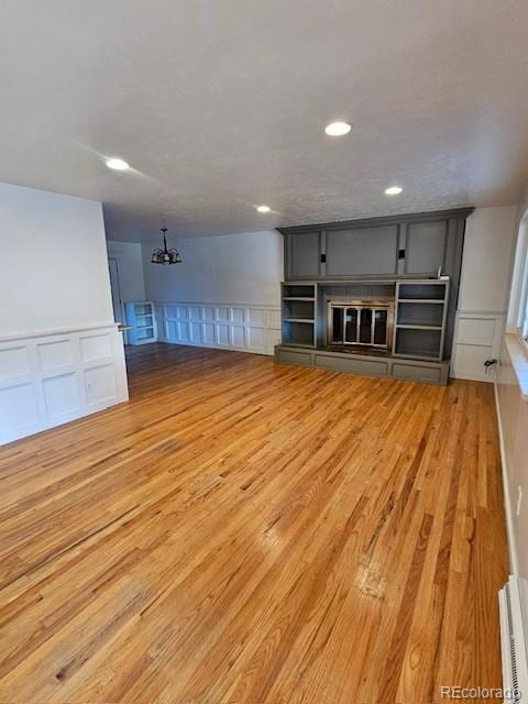 unfurnished living room with light wood-type flooring