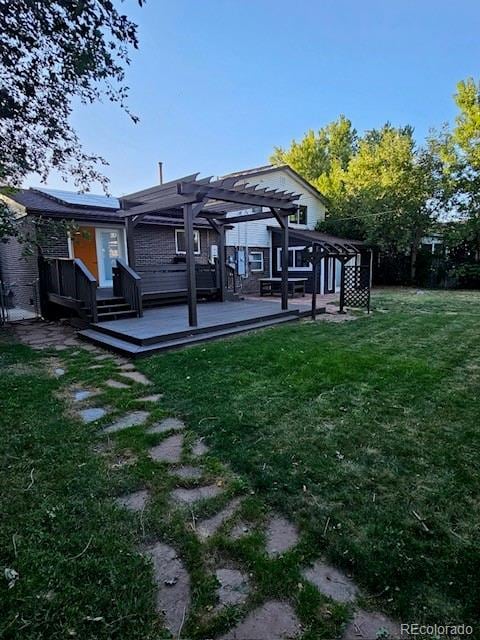 view of yard with a wooden deck and a pergola