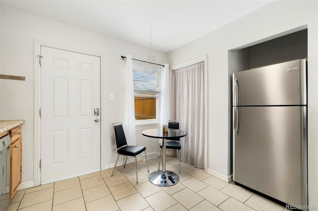 dining area featuring light tile patterned floors