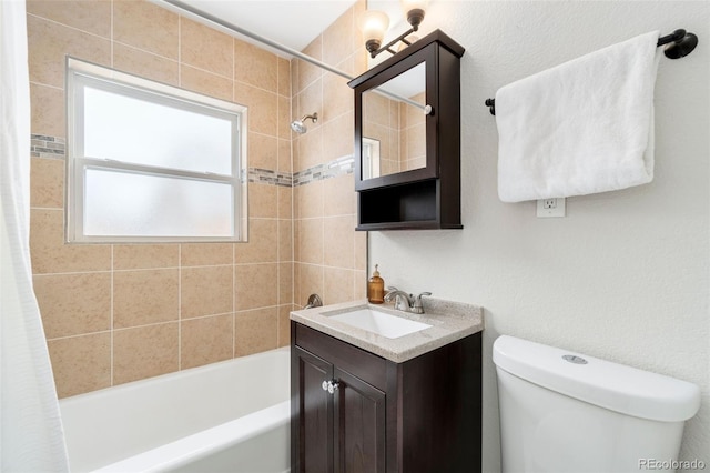 full bathroom featuring shower / bath combo with shower curtain, vanity, and toilet