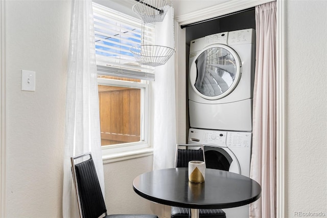 laundry room with stacked washer / drying machine