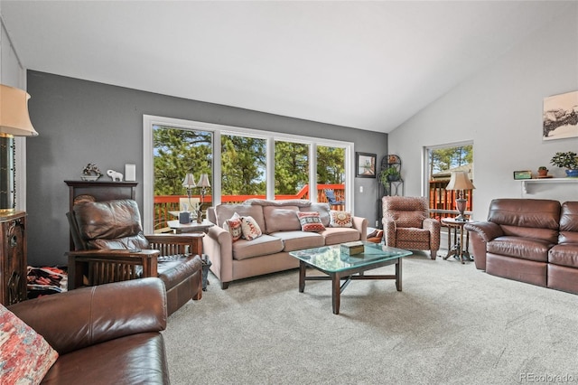 living room with carpet and vaulted ceiling