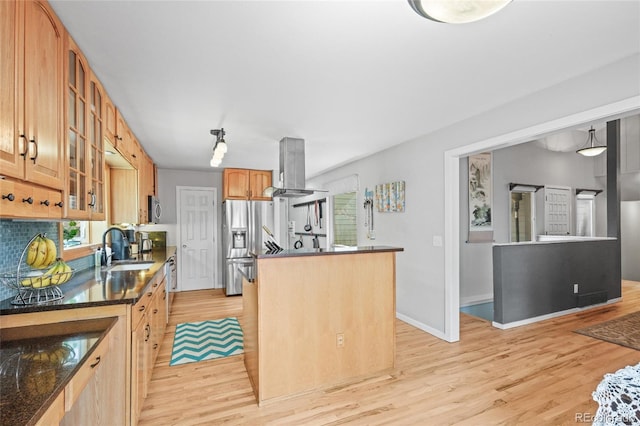 kitchen with island exhaust hood, a center island, light wood-type flooring, a sink, and stainless steel appliances