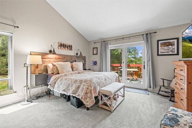 bedroom with lofted ceiling, light carpet, and access to exterior