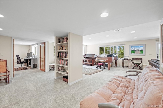 living room with visible vents, recessed lighting, and carpet