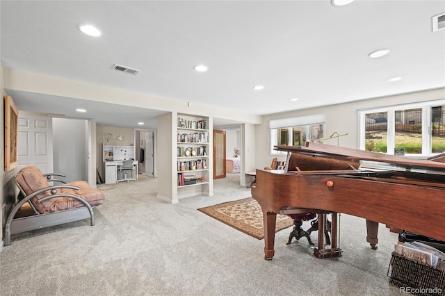 living area featuring carpet flooring, recessed lighting, and visible vents