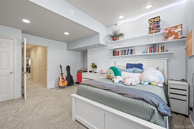 bedroom with light carpet and recessed lighting