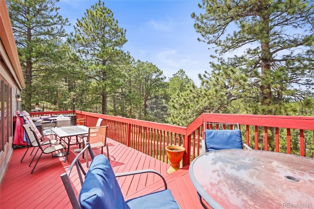 wooden deck with outdoor dining area