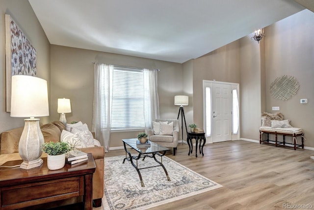 7329 Arco Iris Ln, Castle Pines, CO 80108 - living room featuring wood finished floors and baseboards