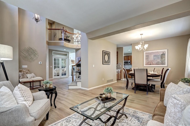 7329 Arco Iris Ln, Castle Pines, CO 80108 - living area with a chandelier and light wood finished floors
