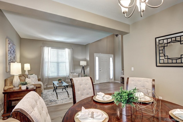 7329 Arco Iris Ln, Castle Pines, CO 80108 - dining space with a chandelier and wood finished floors