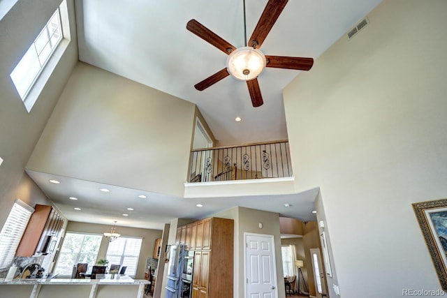 7329 Arco Iris Ln, Castle Pines, CO 80108 - living area featuring a ceiling fan, a high ceiling, and recessed lighting