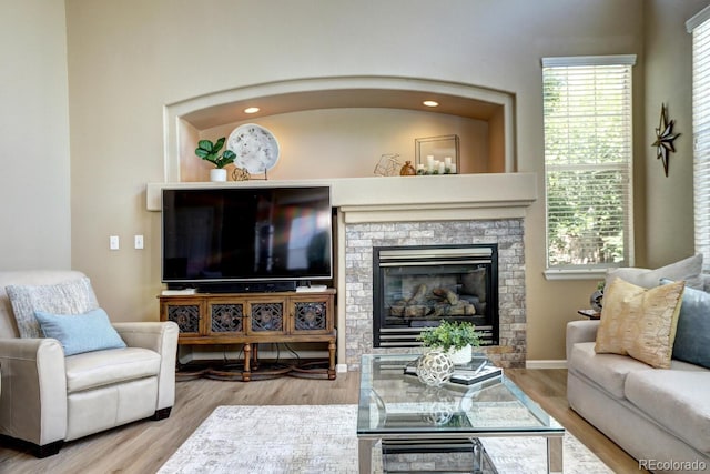 7329 Arco Iris Ln, Castle Pines, CO 80108 - living room with wood finished floors and a fireplace