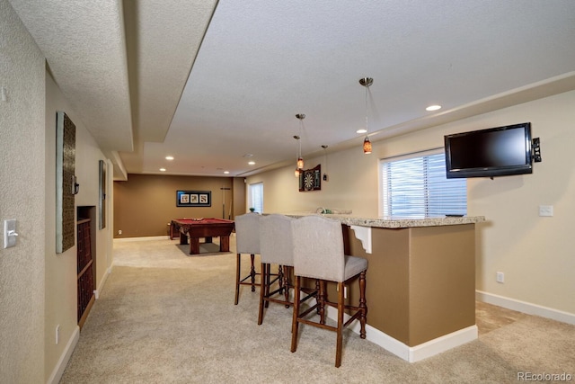 7329 Arco Iris Ln, Castle Pines, CO 80108 - kitchen with pool table, light colored carpet, healthy amount of natural light, a kitchen bar, and recessed lighting