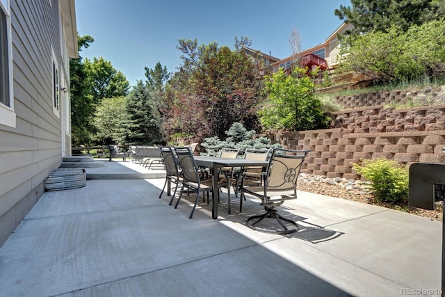 7329 Arco Iris Ln, Castle Pines, CO 80108 - view of patio / terrace featuring outdoor dining area