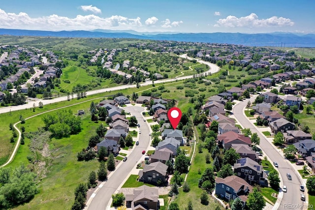 7329 Arco Iris Ln, Castle Pines, CO 80108 - aerial perspective of suburban area with a mountainous background