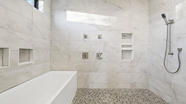 bathroom featuring plus walk in shower