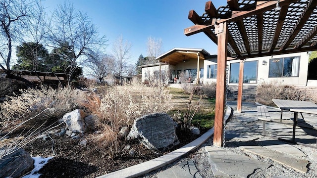 view of yard featuring a pergola and a patio