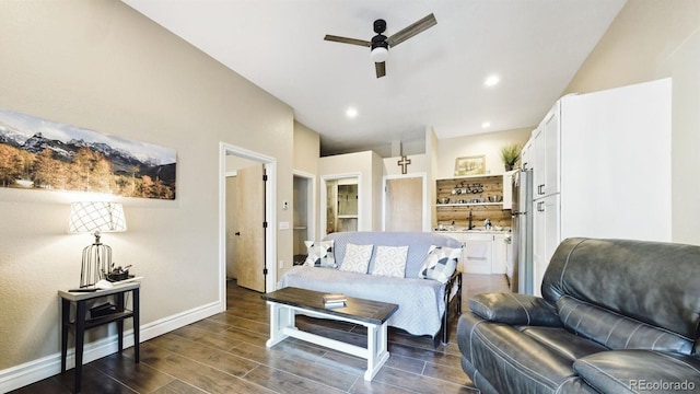 living room with ceiling fan and sink