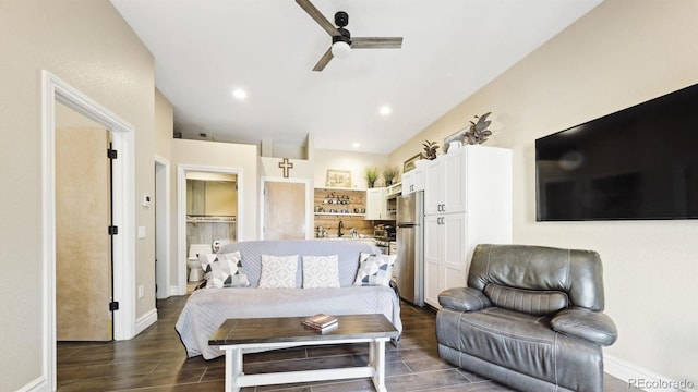 living room with ceiling fan and sink