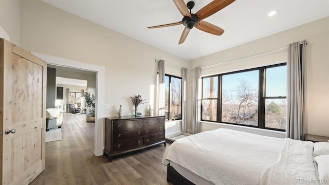 bedroom featuring a ceiling fan, recessed lighting, and wood finished floors