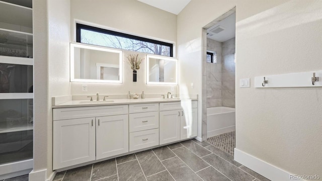 full bathroom featuring double vanity, visible vents, a sink, walk in shower, and a bath