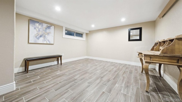 living area with wood tiled floor, baseboards, and recessed lighting