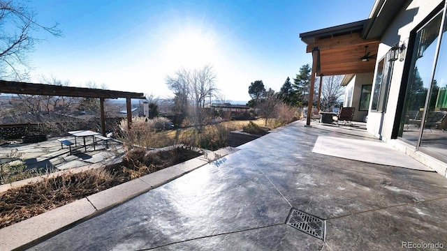 view of patio featuring a ceiling fan