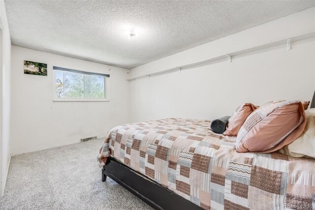 359 S 25th Ave, Brighton, CO 80601 - bedroom featuring carpet floors and a textured ceiling
