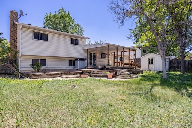359 S 25th Ave, Brighton, CO 80601 - rear view of house featuring a chimney, a patio area, and central air condition unit