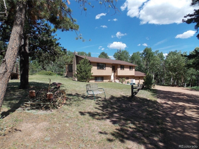 171 Broken Wagon Rd, Woodland Park, CO 80863 - back of house featuring a yard