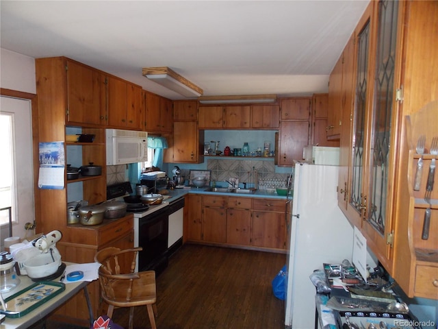 171 Broken Wagon Rd, Woodland Park, CO 80863 - kitchen featuring white appliances, brown cabinets, and healthy amount of natural light