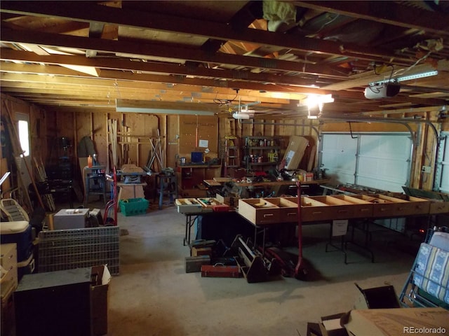 171 Broken Wagon Rd, Woodland Park, CO 80863 - garage with a garage door opener and a workshop area