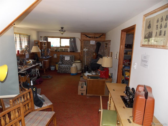 171 Broken Wagon Rd, Woodland Park, CO 80863 - carpeted living area with a wood stove