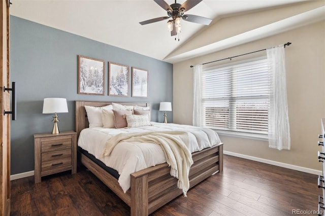 bedroom featuring lofted ceiling, baseboards, dark wood finished floors, and a ceiling fan