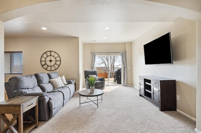 living area with light carpet, baseboards, and recessed lighting