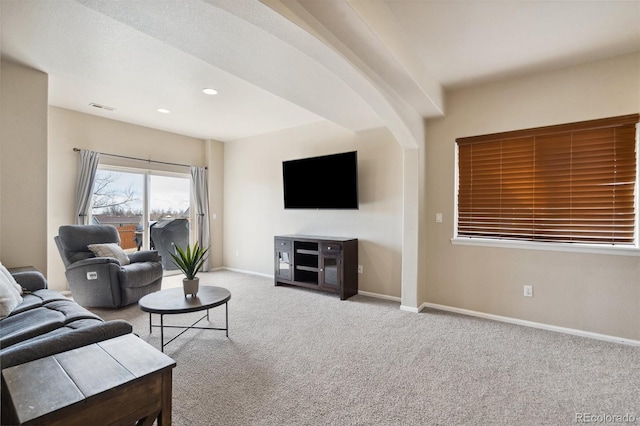 living area featuring carpet floors, recessed lighting, visible vents, and baseboards