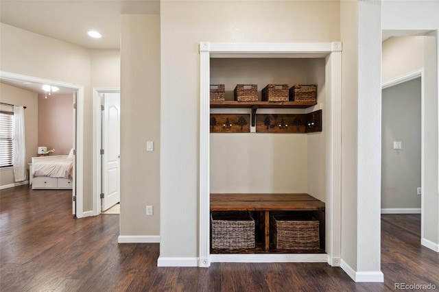 mudroom with wood finished floors and baseboards