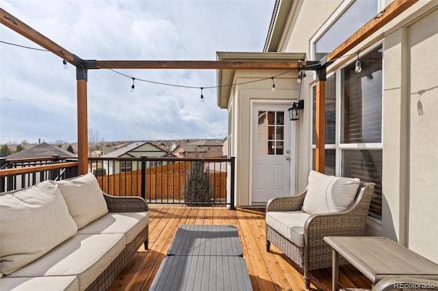 wooden terrace featuring an outdoor living space