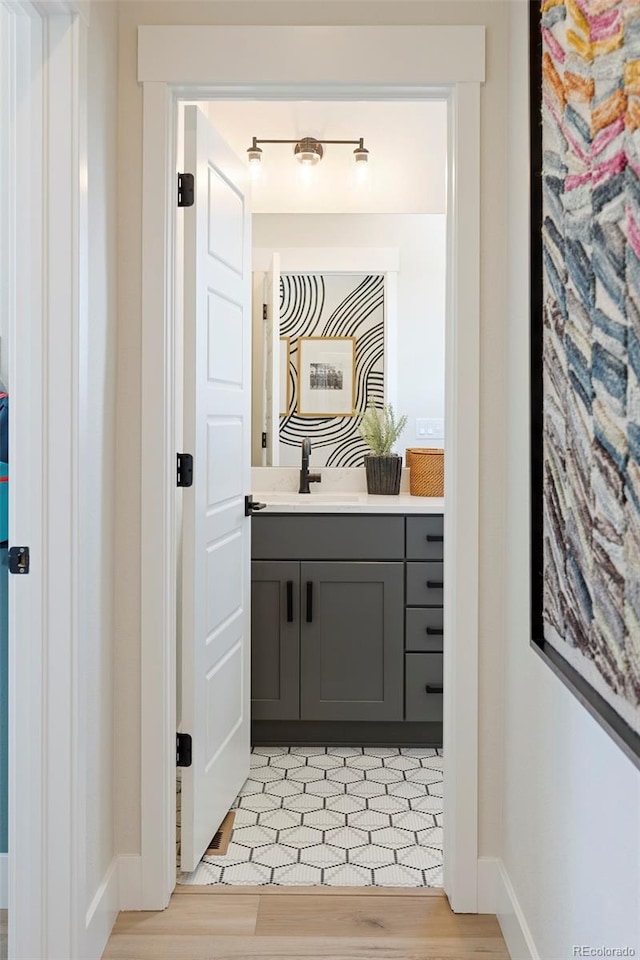 bathroom featuring vanity and wood-type flooring